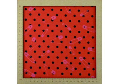 Red jersey fabric with small black polka dots and pink safety pins