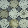 Beige and white clocks fabric on a gray background