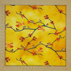 Yellow jersey fabric with small birds and tree branches