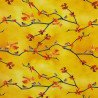 Yellow jersey fabric with small birds and tree branches