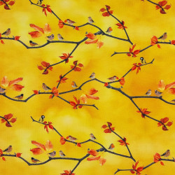 Yellow jersey fabric with small birds and tree branches