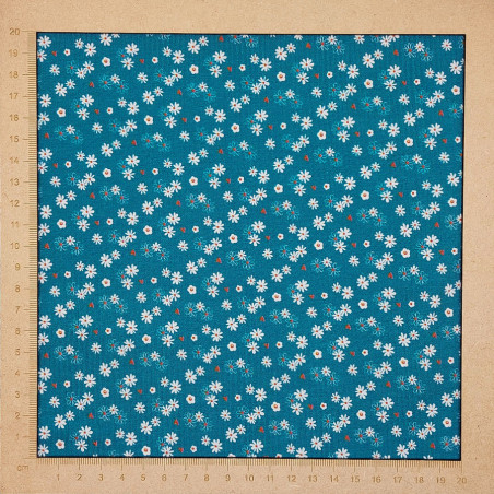 Teal blue jersey fabric with pretty little flower patterns